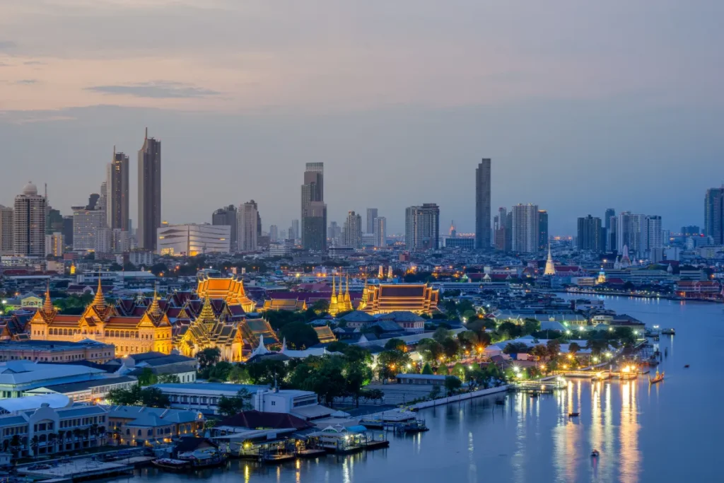 Grand Palace and Chao Phraya River at twilight in Bangkok
