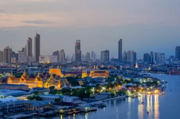 Grand Palace and Chao Phraya River at twilight in Bangkok