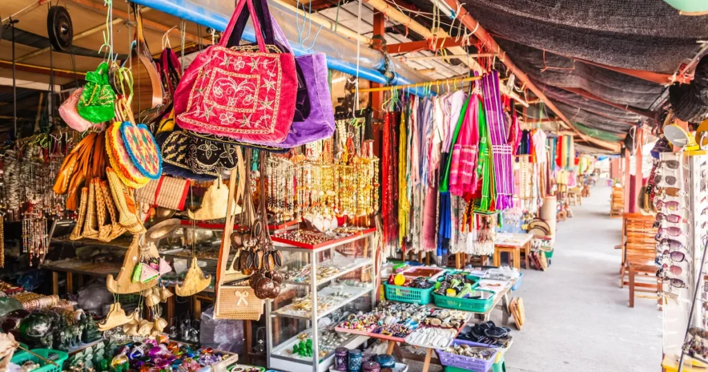Colourful market stalls with handmade bags and crafts