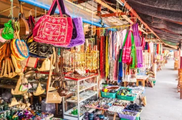 Colourful market stalls with handmade bags and crafts