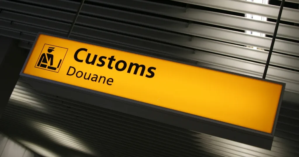 Bilingual customs sign at an airport