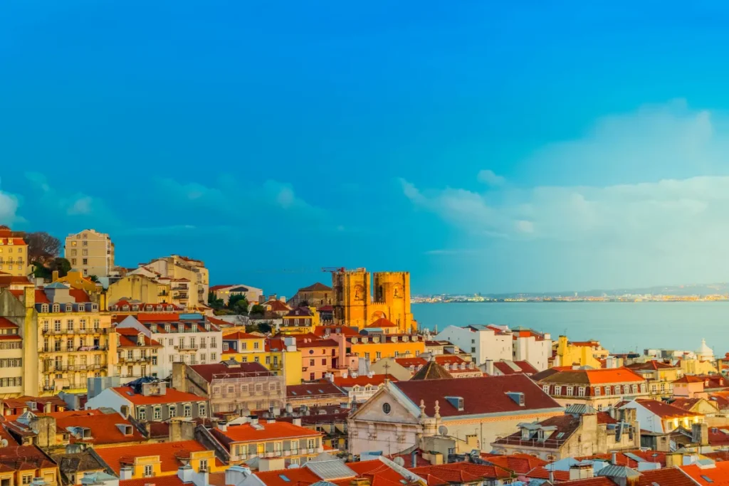 Lisbon rooftops and cathedral at golden hour
