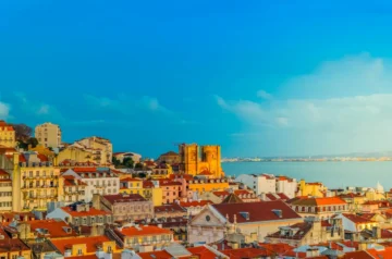 Lisbon rooftops and cathedral at golden hour