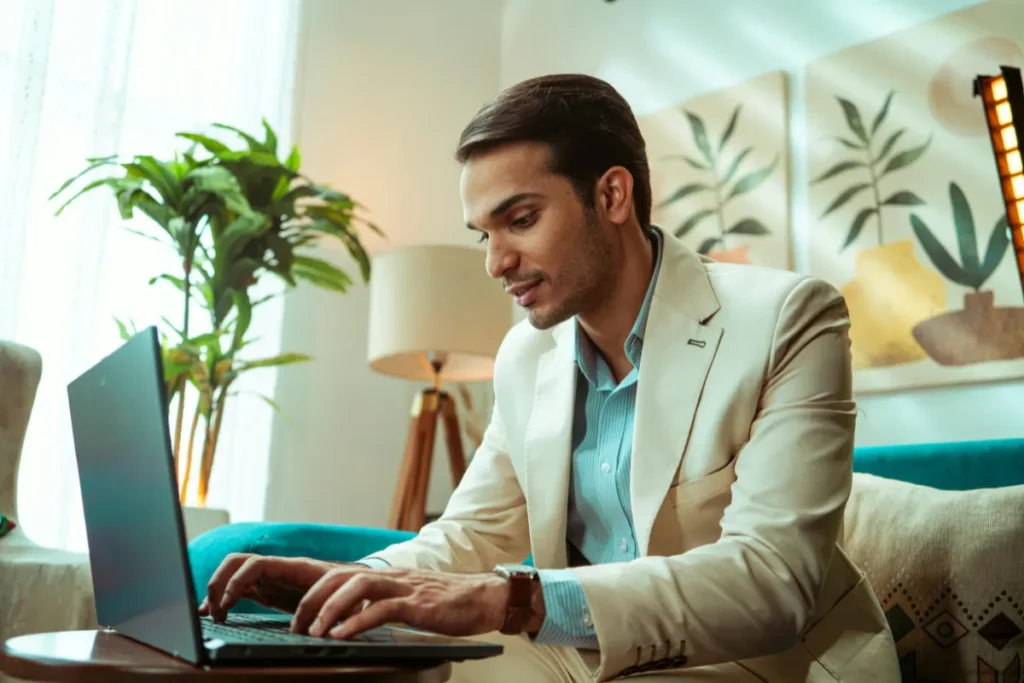 Man working on laptop in an upscale setting
