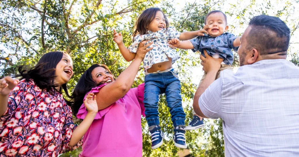 Mexican family playing together in the park