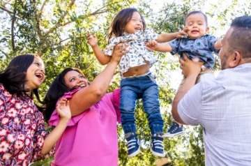 Mexican family playing together in the park