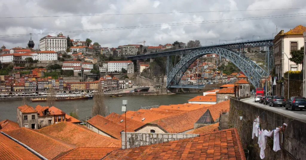 Porto rooftops and Dom Luis Bridge on a cloudy day