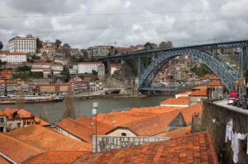 Porto rooftops and Dom Luis Bridge on a cloudy day