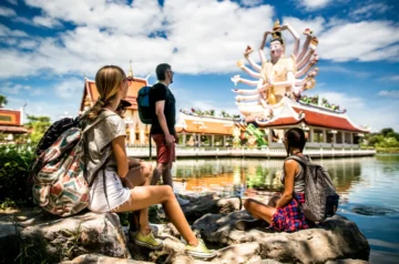 Travellers visiting a temple in Koh Samui, Thailand