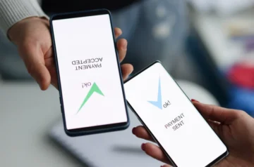 Two phones showing a confirmed money transfer